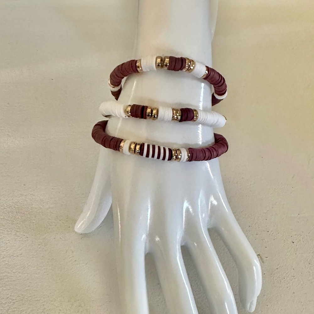 Dark Brown and White Clay Beaded Stretch Bracelets with gold accents.